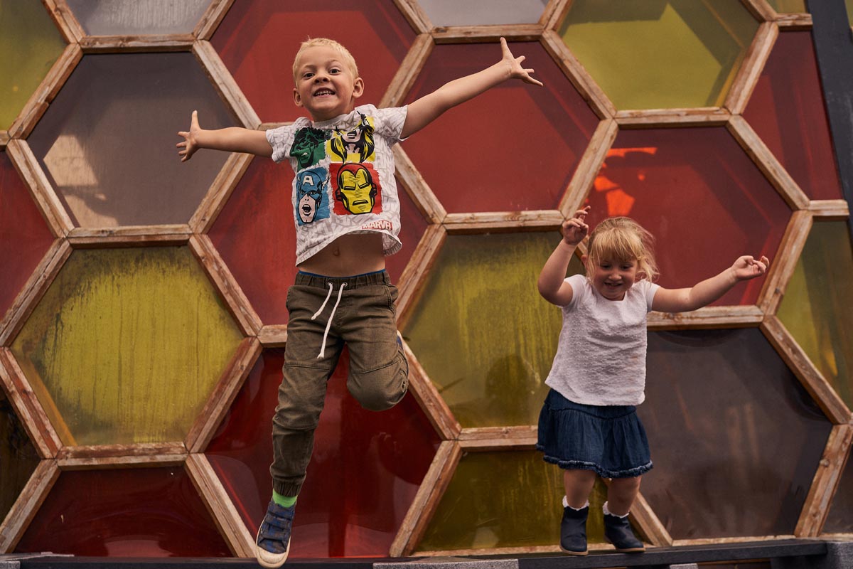 children jumping off a bench at the cie cream farm chester