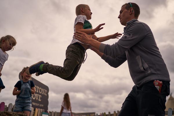 children jumping off a bench at the cie cream farm chester
